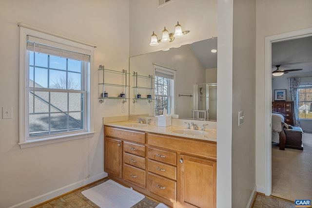 ensuite bathroom with plenty of natural light, ensuite bath, and a sink