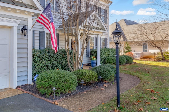 doorway to property with a yard