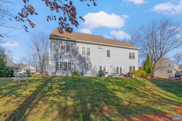 back of house with a yard