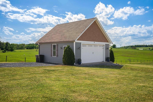detached garage featuring fence
