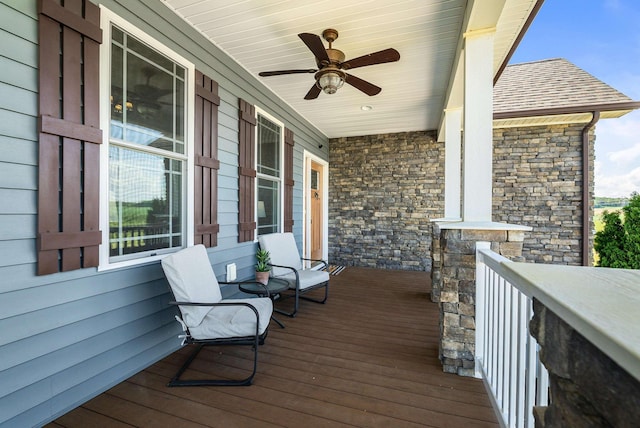 deck featuring a ceiling fan and covered porch