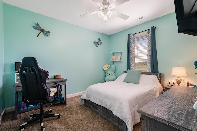 bedroom featuring visible vents, a ceiling fan, baseboards, and carpet floors