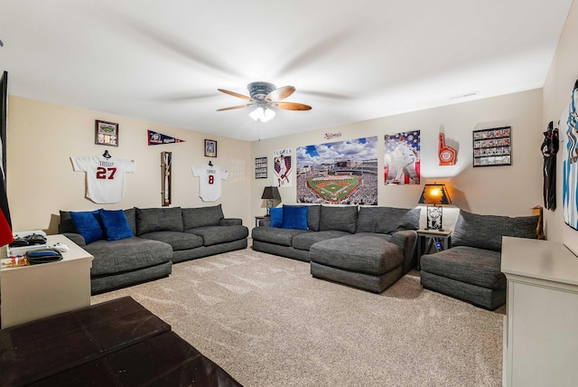 carpeted living area with ceiling fan and visible vents