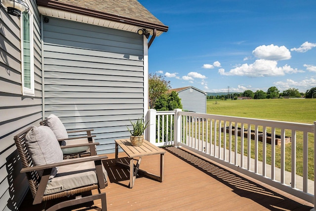 wooden terrace with a yard