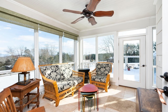 sunroom featuring ceiling fan