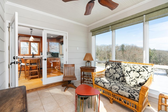 sunroom / solarium with ceiling fan and a wealth of natural light