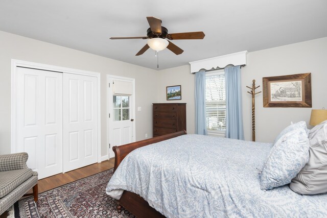 bedroom featuring hardwood / wood-style floors, ceiling fan, and a closet