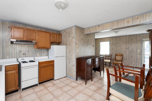 kitchen featuring a textured ceiling and white appliances