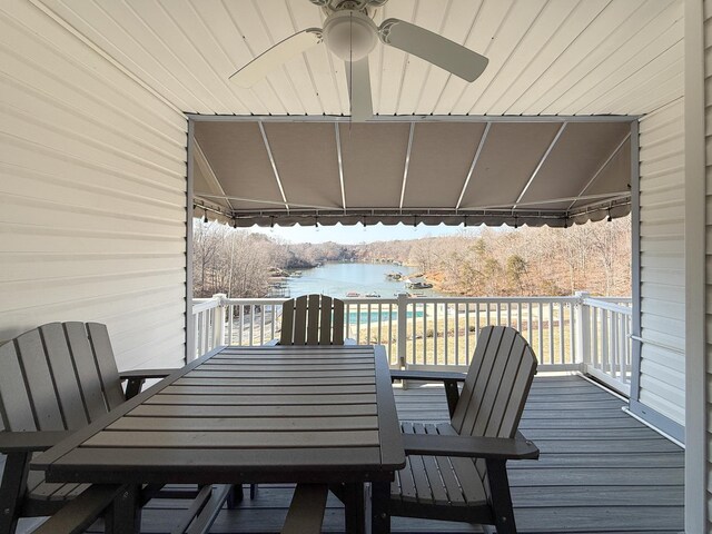 wooden terrace featuring a water view and ceiling fan