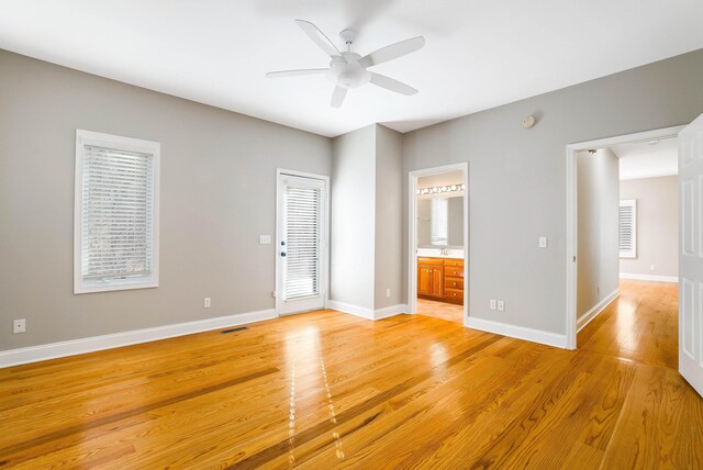 interior space with ceiling fan, plenty of natural light, and light wood-type flooring