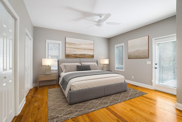 bedroom with ceiling fan and dark hardwood / wood-style flooring