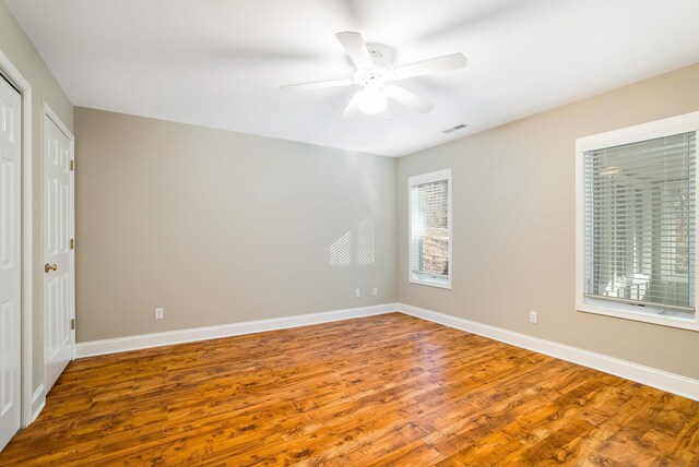 unfurnished bedroom featuring hardwood / wood-style flooring and ceiling fan