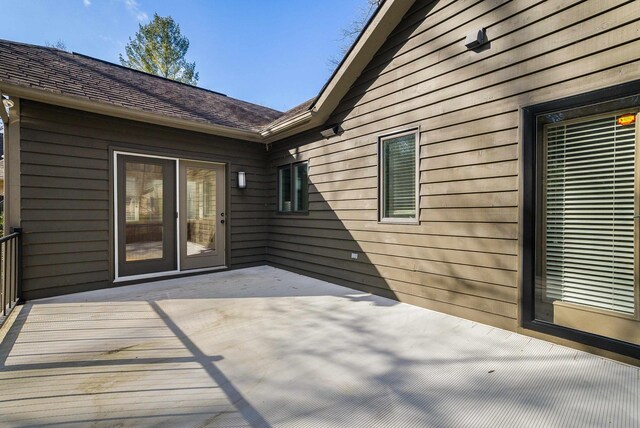 wooden deck featuring a patio area