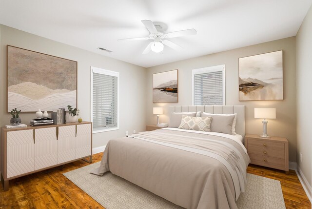 bedroom with dark wood-type flooring and ceiling fan