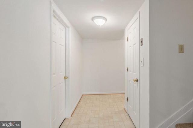 corridor featuring baseboards