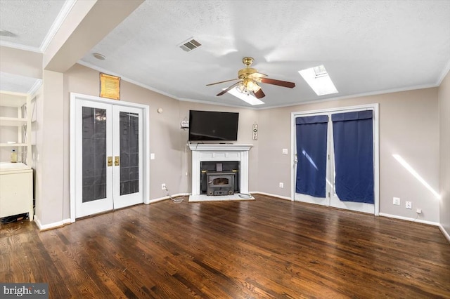 unfurnished living room with french doors, ornamental molding, and a ceiling fan