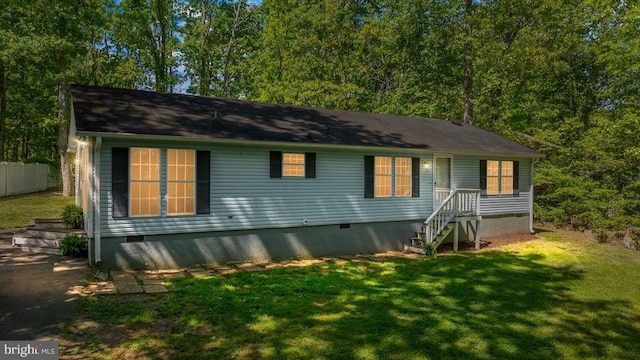view of front of house featuring crawl space and a front yard