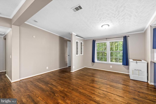interior space featuring baseboards, wood finished floors, and visible vents
