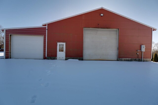 view of snow covered garage