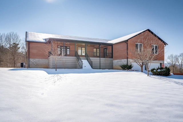 view of front of property with a garage and covered porch