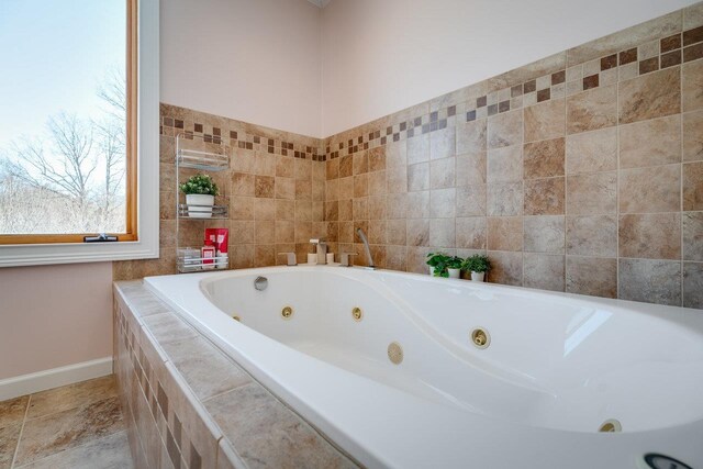 bathroom featuring tiled bath