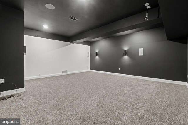 cinema room featuring carpet floors