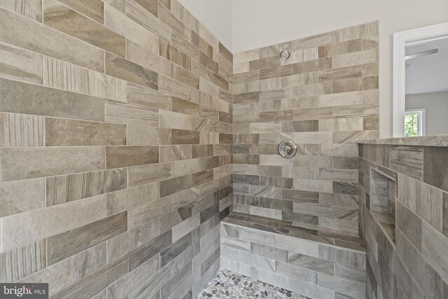 bathroom with tiled shower