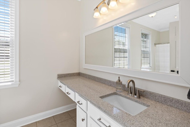 bathroom with vanity, tile patterned flooring, and walk in shower