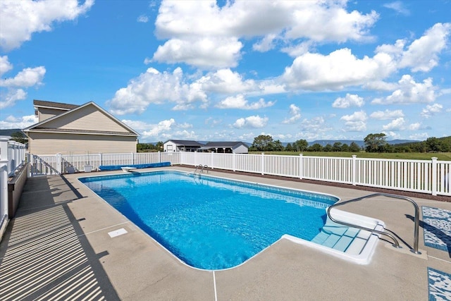 view of pool featuring a patio