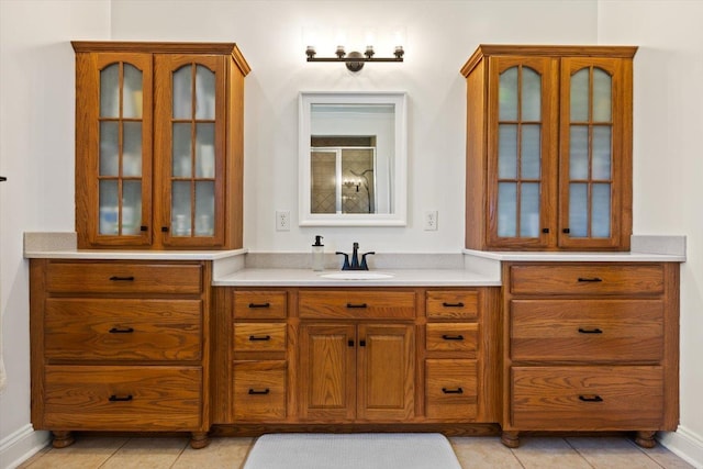 bathroom featuring vanity, tile patterned floors, and a shower with shower door