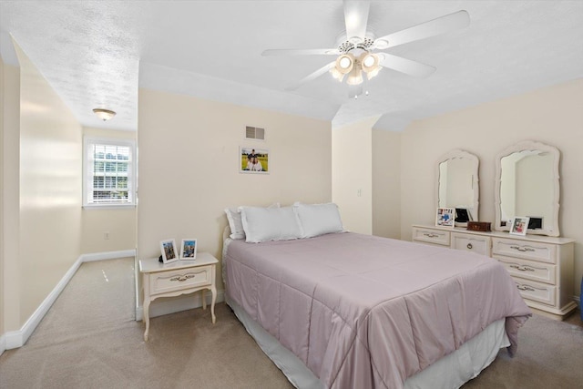 bedroom with light carpet and ceiling fan