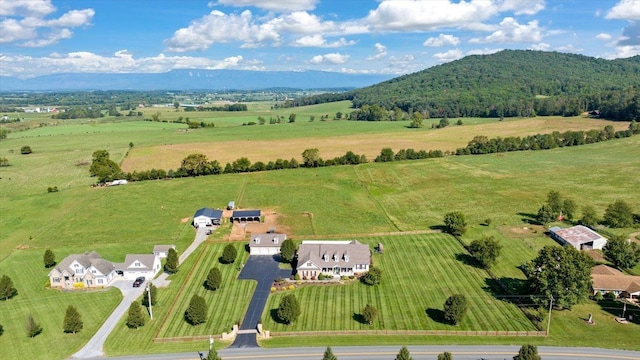 drone / aerial view featuring a mountain view and a rural view