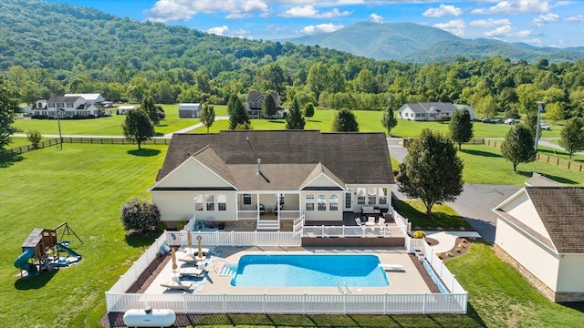 view of pool featuring a playground and a patio