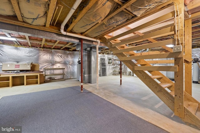 basement featuring gas water heater