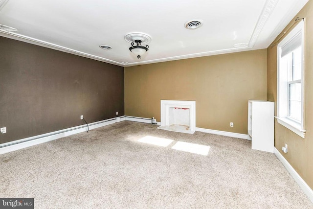 carpeted empty room with baseboards, baseboard heating, visible vents, and crown molding