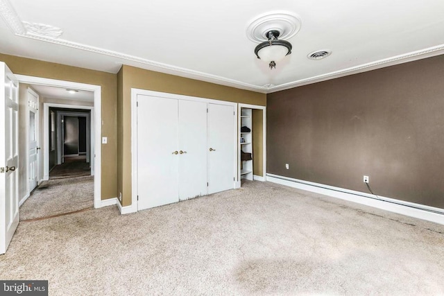 unfurnished bedroom featuring carpet floors, visible vents, and baseboards