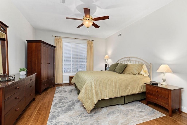 bedroom featuring ceiling fan and light wood-type flooring