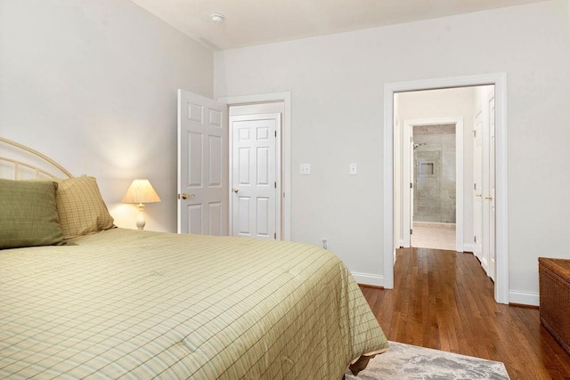 bedroom featuring dark hardwood / wood-style flooring