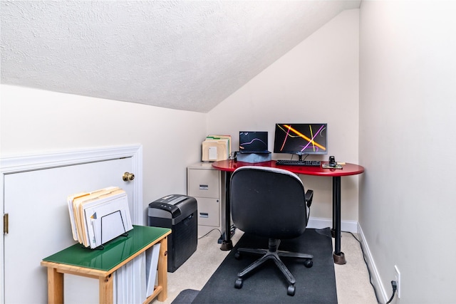 carpeted office space with lofted ceiling and a textured ceiling