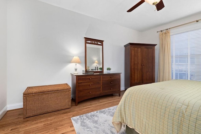 bedroom with ceiling fan and light wood-type flooring