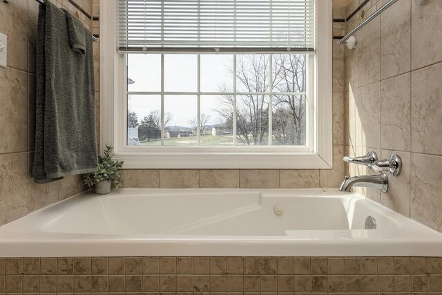 bathroom with tiled tub