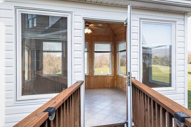 unfurnished sunroom with wooden ceiling