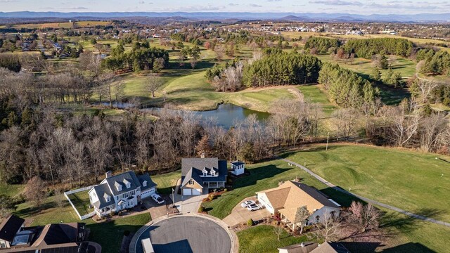 drone / aerial view featuring a water and mountain view