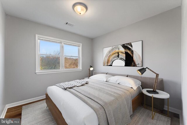 bedroom with hardwood / wood-style flooring