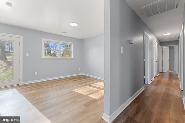 hallway featuring light hardwood / wood-style flooring