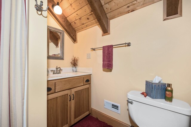 bathroom with wood ceiling, vanity, toilet, and vaulted ceiling with beams