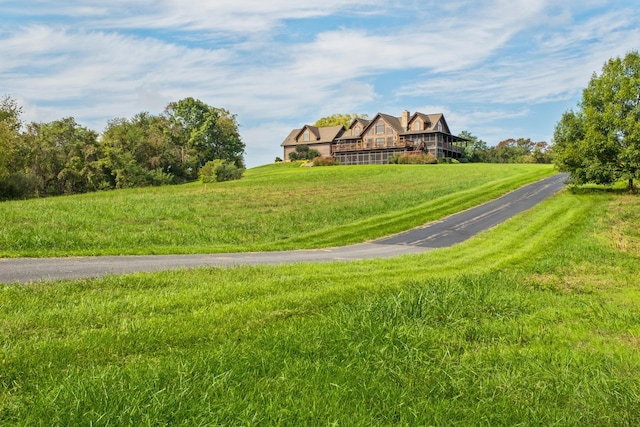 view of property's community with a lawn