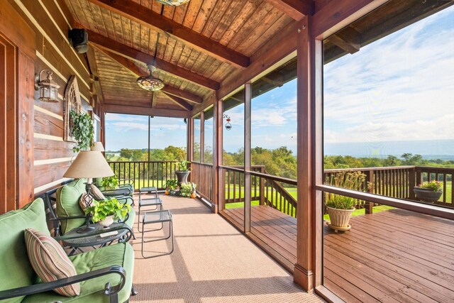 sunroom / solarium with lofted ceiling with beams and wooden ceiling