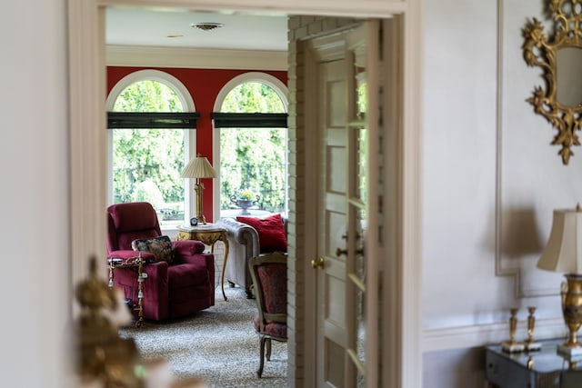 entryway featuring visible vents and crown molding