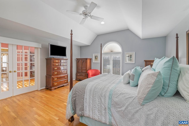 bedroom with lofted ceiling, french doors, wood finished floors, and a ceiling fan